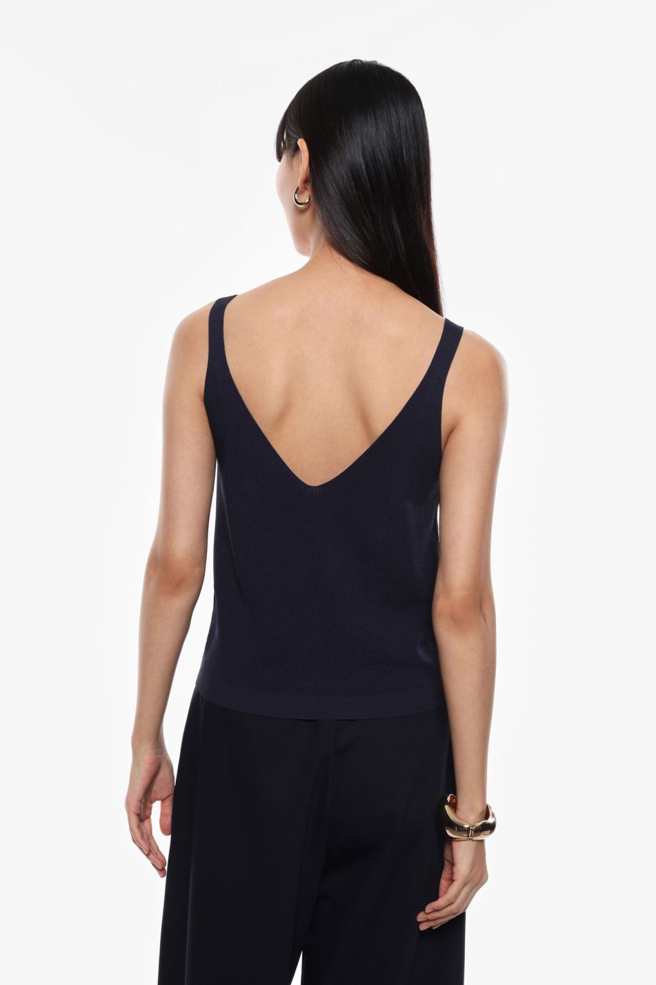 Top smanicato in maglia con bottoni