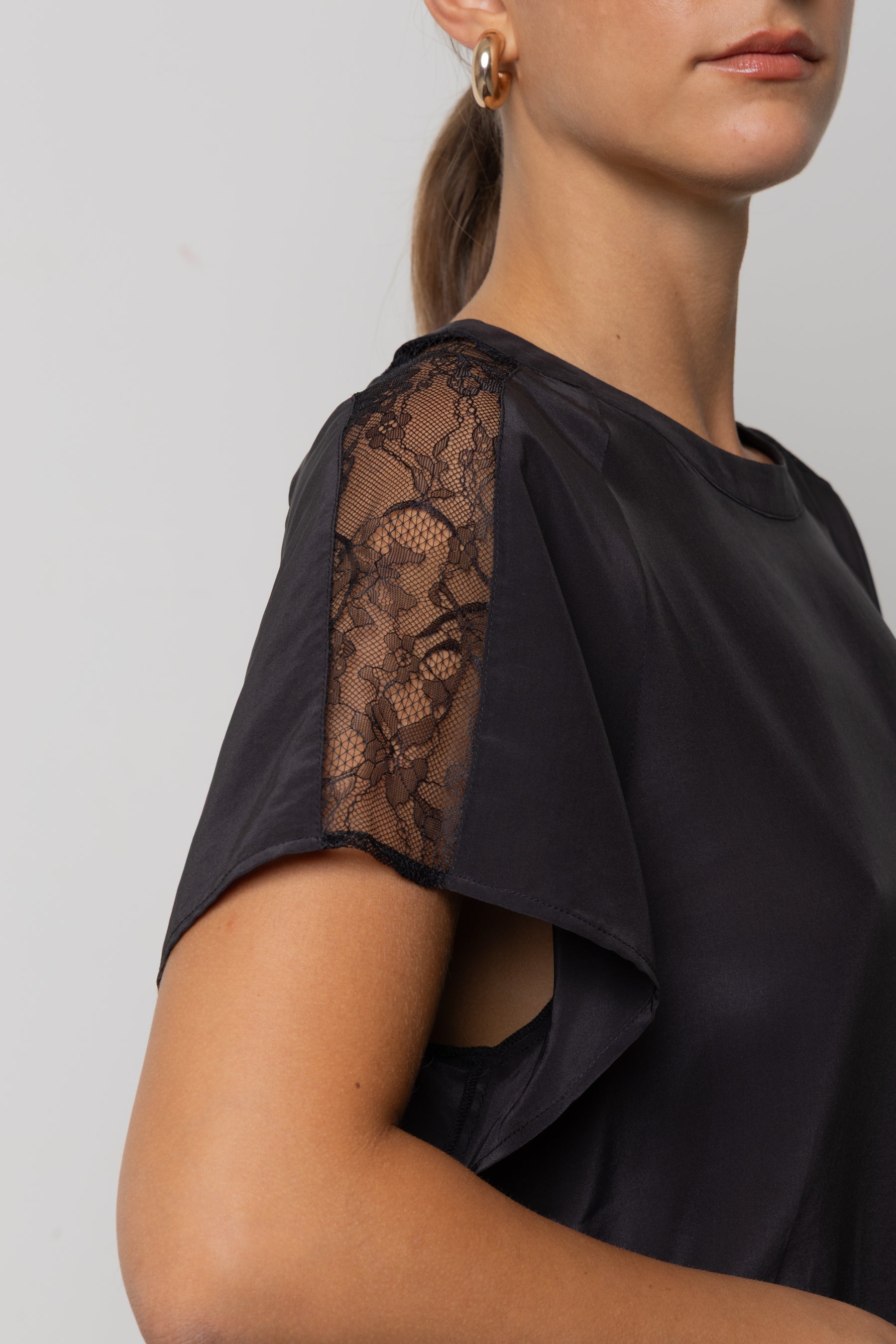 Blusa con inserti in pizzo Icona